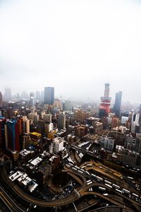 High angle view of buildings in city against clear sky