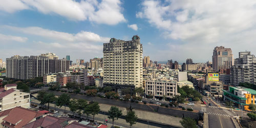 High angle view of buildings in city against sky