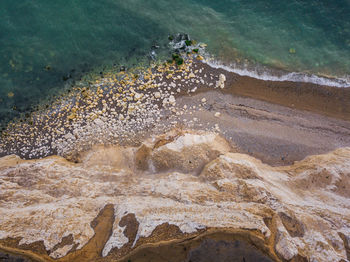 High angle view of rocks in sea