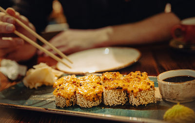 Midsection of person preparing food on table