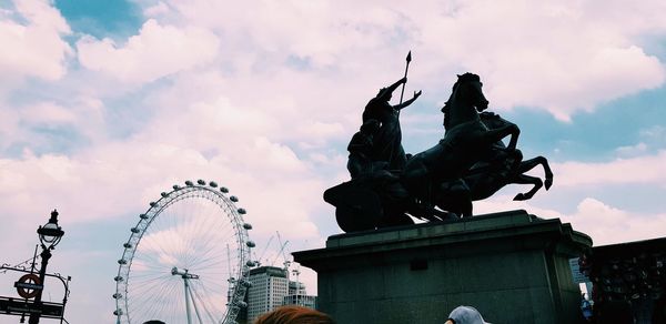 Low angle view of statue against sky