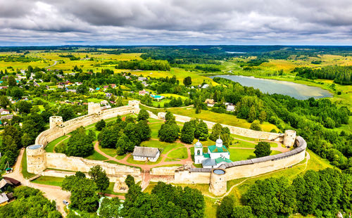 High angle view of trees and buildings against sky