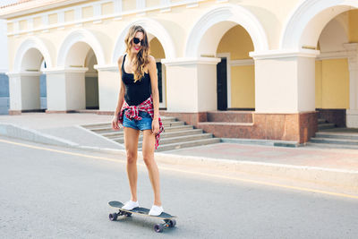 Full length of woman standing in city