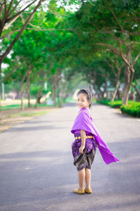 Portrait of a girl standing on road