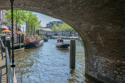 Arch bridge over river in city