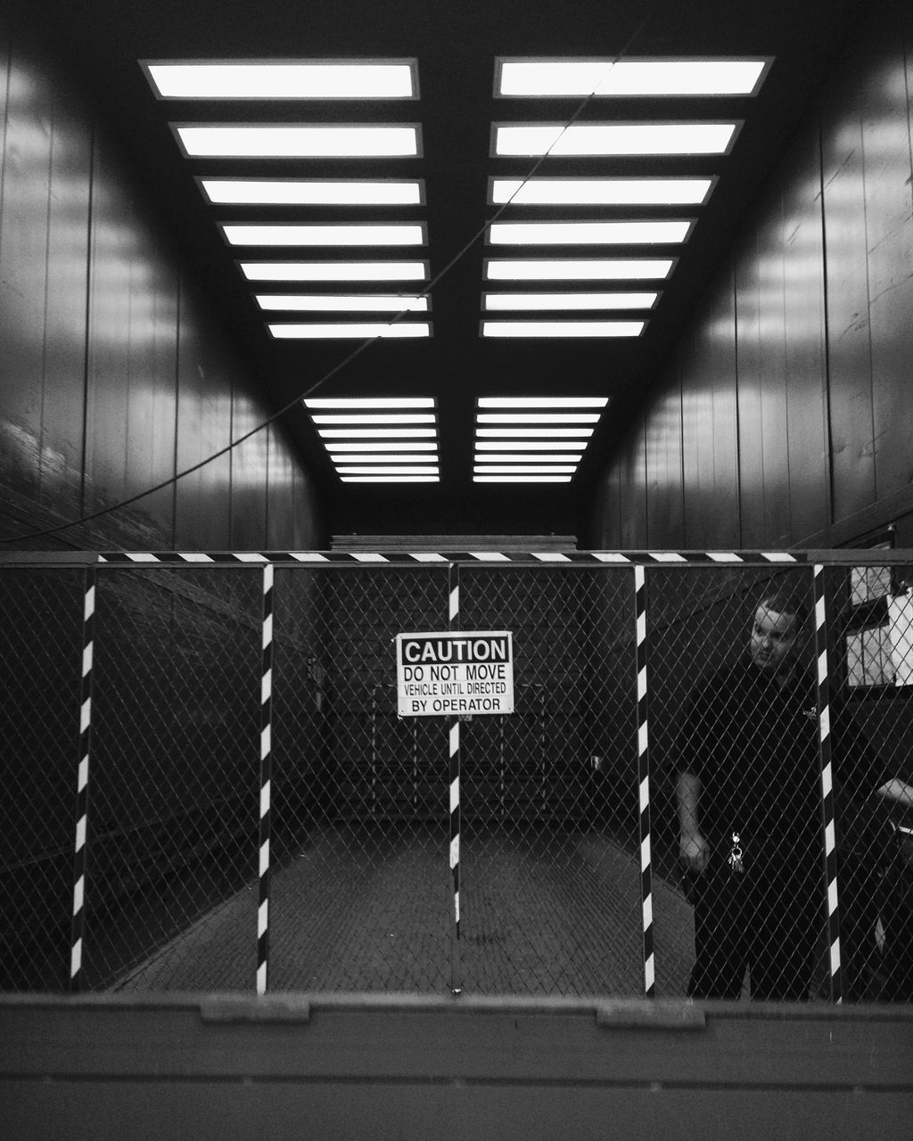 text, western script, transportation, communication, built structure, architecture, information sign, indoors, sign, safety, protection, railroad station platform, graffiti, security, metal, railroad station, wall - building feature, railing, guidance, day