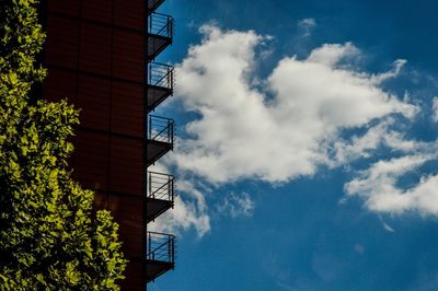 Low angle view of building against cloudy sky