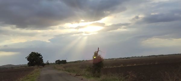 Scenic view of land against sky during sunset