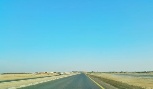 Empty road along landscape