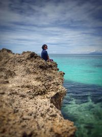 Scenic view of sea against cloudy sky