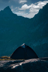 Scenic view of sea and mountains against sky