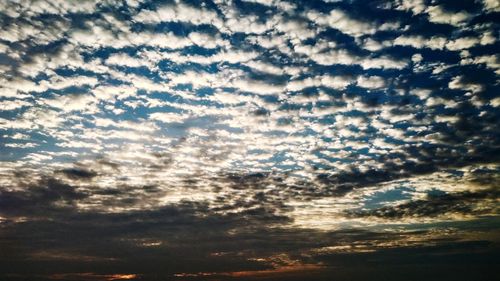 Low angle view of clouds in sky during sunset