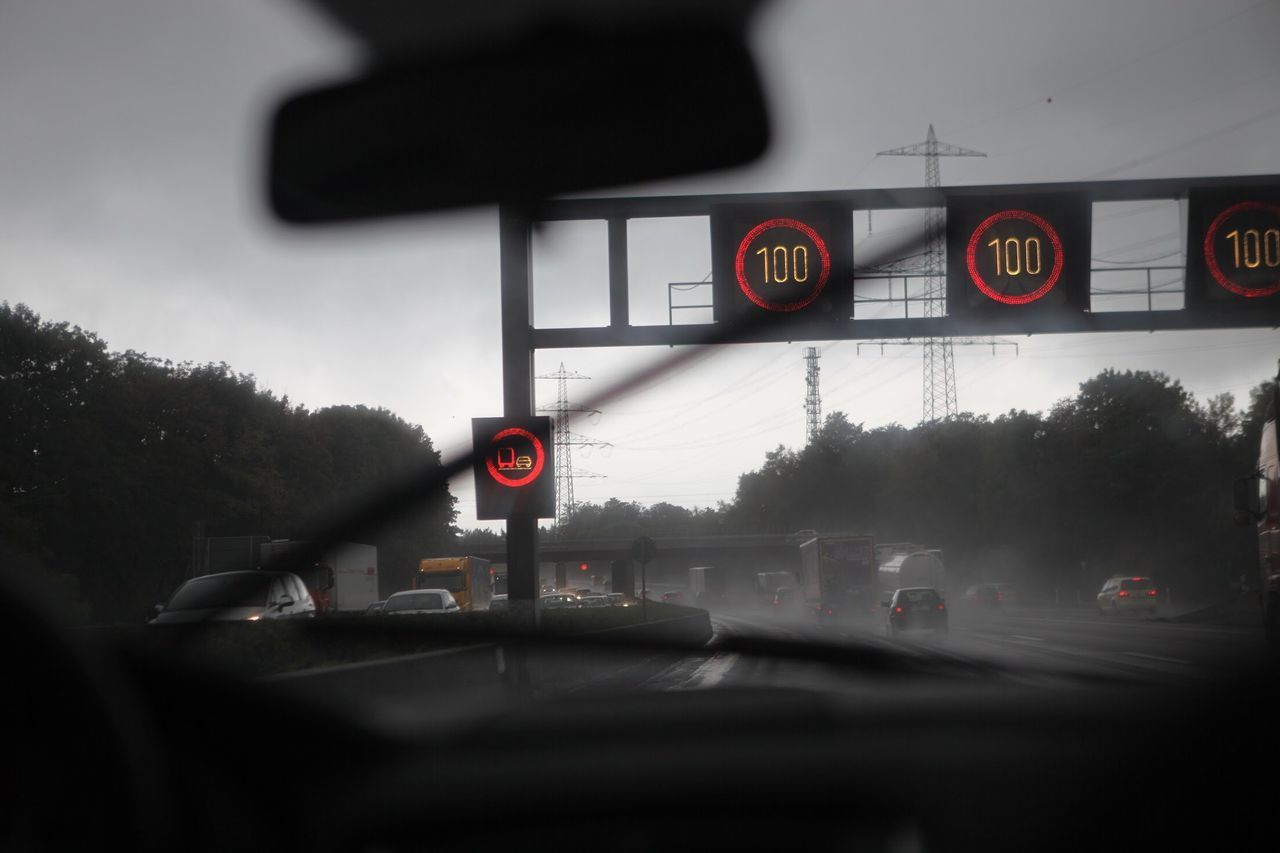 ROAD SIGN ON CAR WINDSHIELD