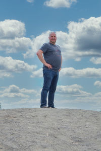 Full length of man standing against sky