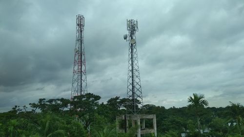 Low angle view of communications tower against sky