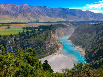 Scenic view of landscape and mountains against sky