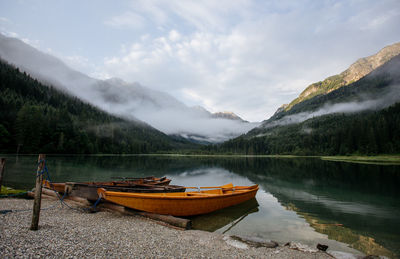 Scenic view of lake and mountains against sky