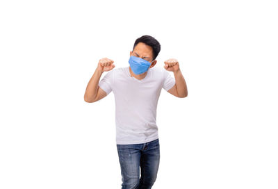 Full length of man standing against white background