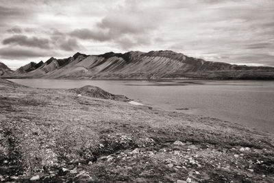 Scenic view of landscape and mountains against sky