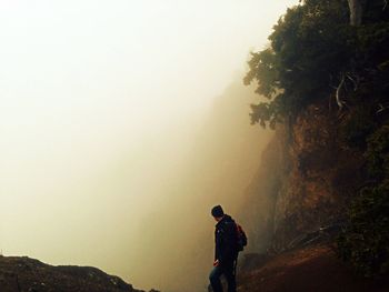 Woman standing on mountain