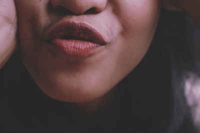 Close-up of woman puckering lips