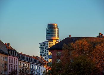 Cityscape against clear blue sky