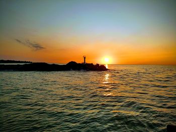 Scenic view of sea against sky during sunset