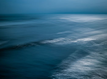 Aerial view of seascape against sky at dusk