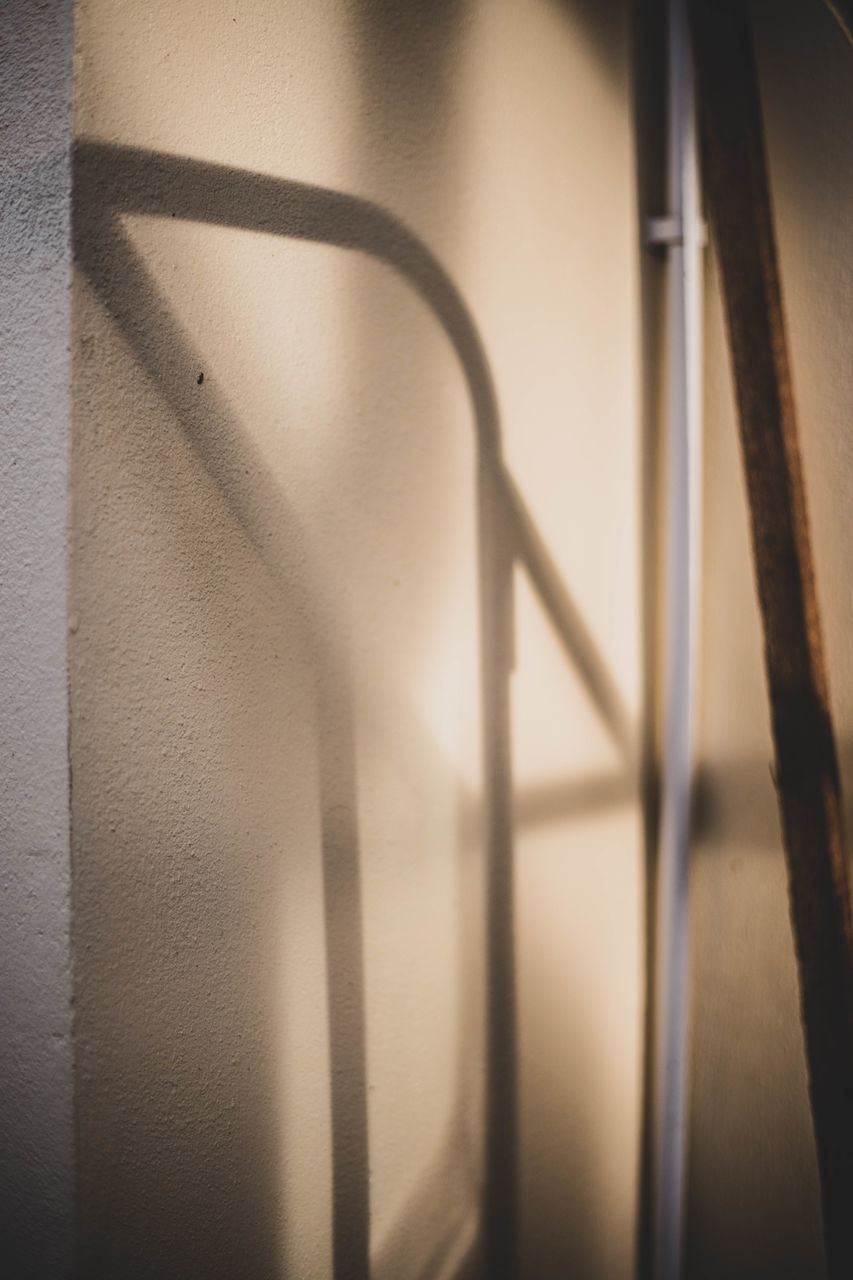 SHADOW OF RAILING ON WALL