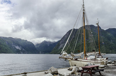 Sailboats moored in bay