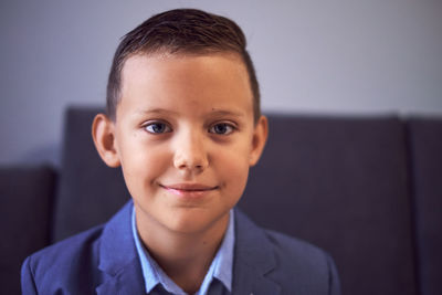 Portrait of boy smiling at home