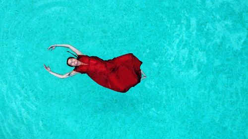 High angle view of man standing in swimming pool