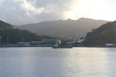 View of boats in river at sunset