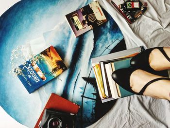 High angle view of man reading book on table