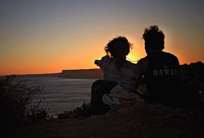 Silhouette people at sunset