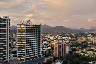 High angle view of buildings in city against sky