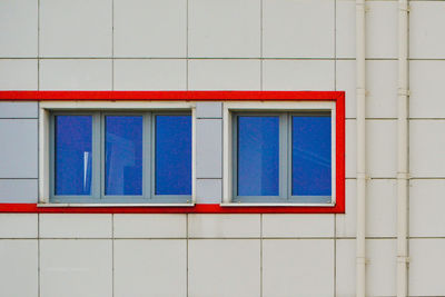 Window on white wall of building