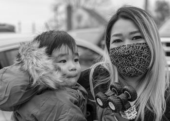 Portrait of mother and son in winter