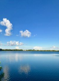 Scenic view of lake against blue sky