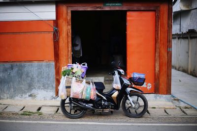 Bicycles parked on street by building