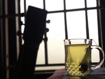 Close-up of beer glass on table