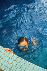 High angle view of woman swimming in sea