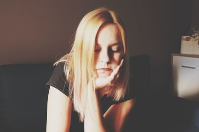 Portrait of beautiful woman sitting at home