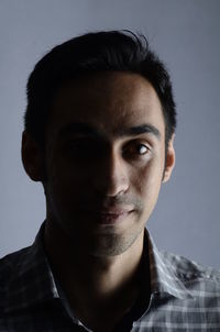 Portrait of young man against clear sky
