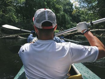 Rear view of man in water