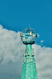 Low angle view of communications tower against sky