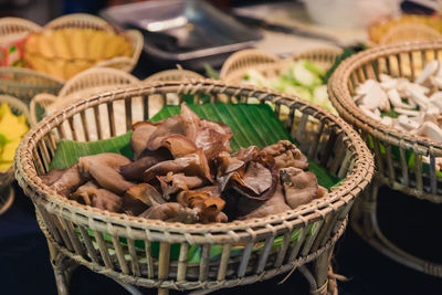 Close-up of mushrooms in basket on table