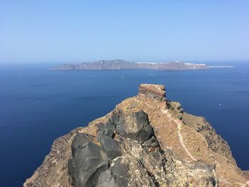 Scenic view of sea and rock formation against sky