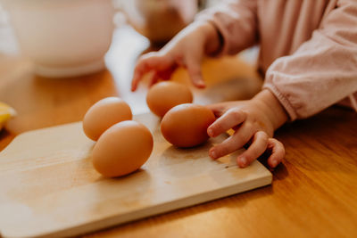 Child picking eggs