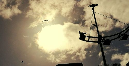 Low angle view of airplane flying in sky